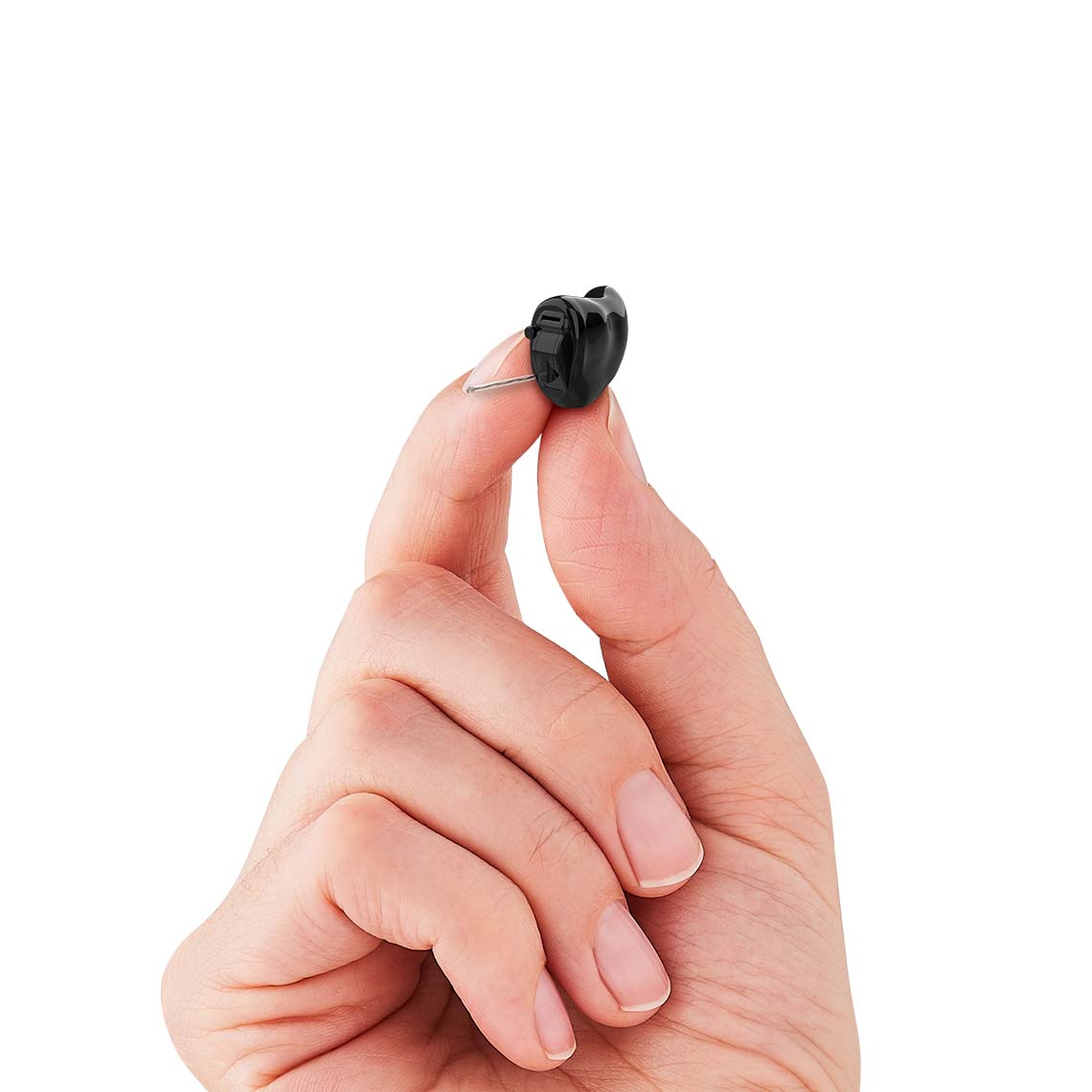 A CIC hearing aid being held in a hand