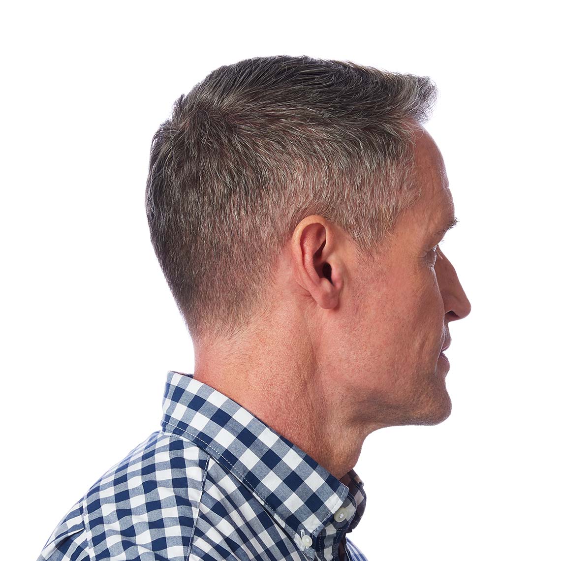 An IIC hearing aid shown in a man's ear