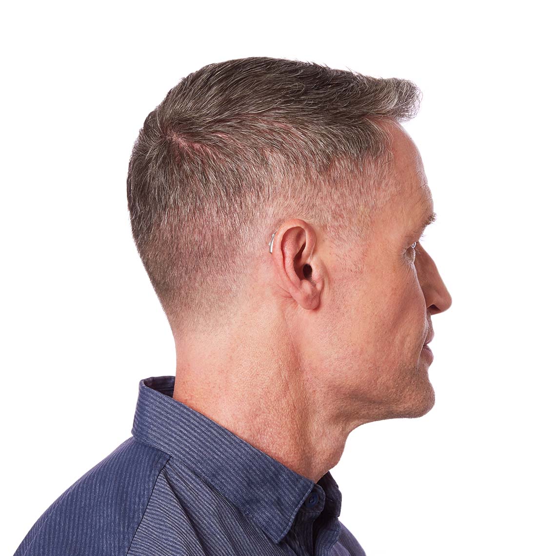 A Sterling RIC 312 shown on a man's ear