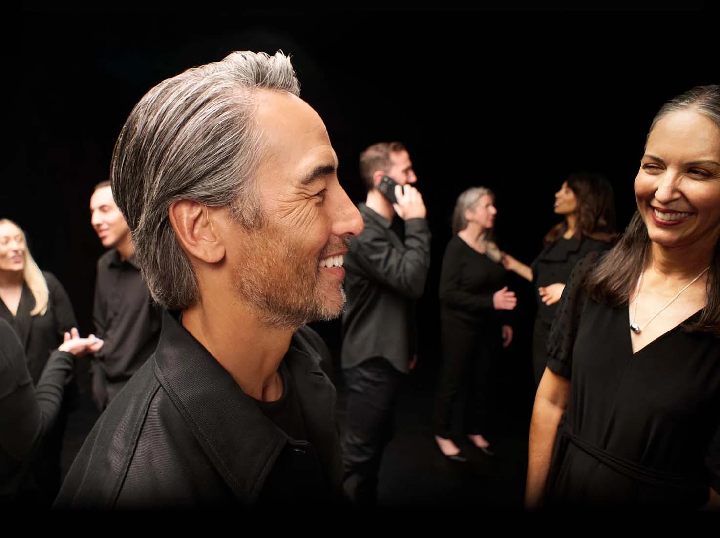 crowd of people in a black room